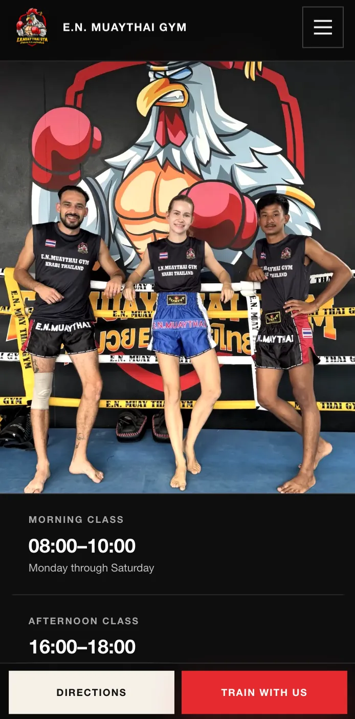 EN Muay Thai's home page on a phone. Under the header, the photograph of three fighters in the gym's ring fills the screen, followed by the class times — MORNING CLASS 08:00–10:00, Monday through Saturday, and AFTERNOON CLASS 16:00–18:00. Pinned across the bottom of the screen, above everything else on the page, two buttons stay in place as it scrolls: Directions and Train with us.